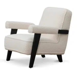 Naomi armchair in ivory white sherpa with timber wood frame and asymmetrical legs for modern spaces