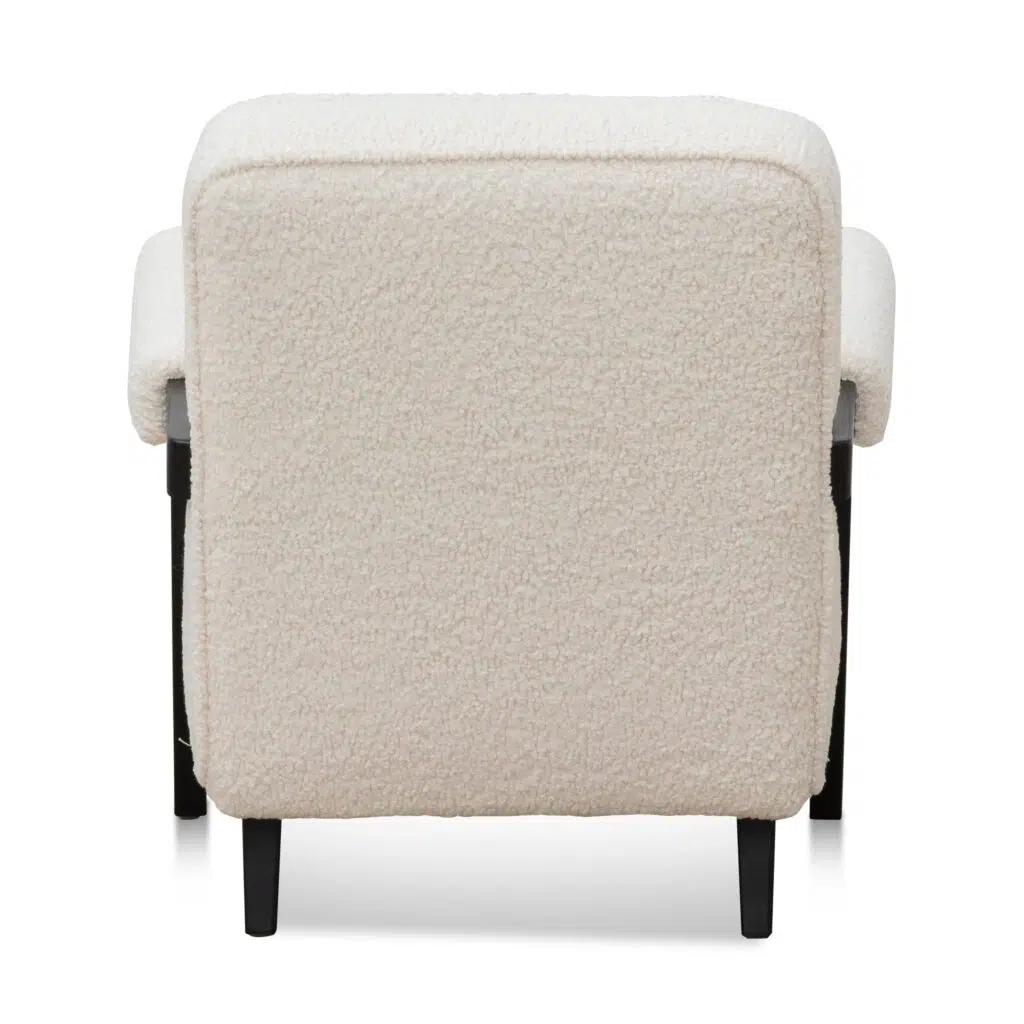 Naomi armchair in ivory white sherpa with timber wood frame and asymmetrical legs for modern spaces