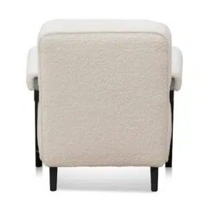 Naomi armchair in ivory white sherpa with timber wood frame and asymmetrical legs for modern spaces