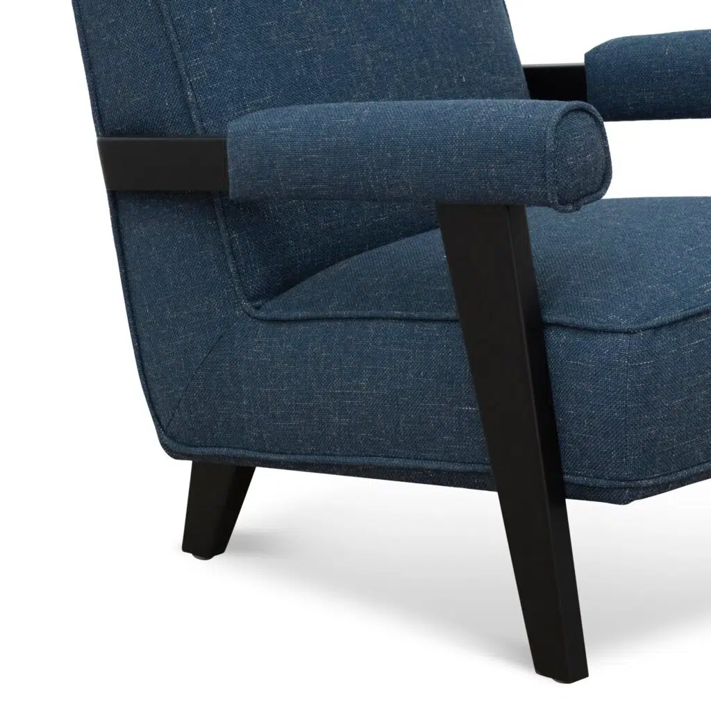 Damon armchair in dark blue fabric with birch legs and plush comfort