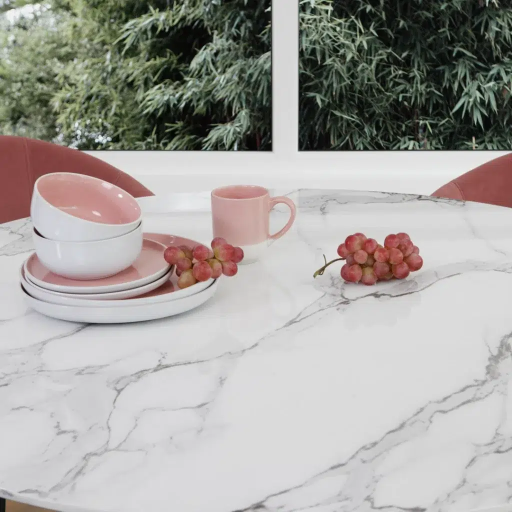 Marble effect white round dining table with tulip base for modern dining rooms
