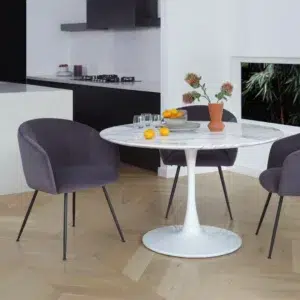 White marble effect round dining table with tulip base for 6 people modern interior