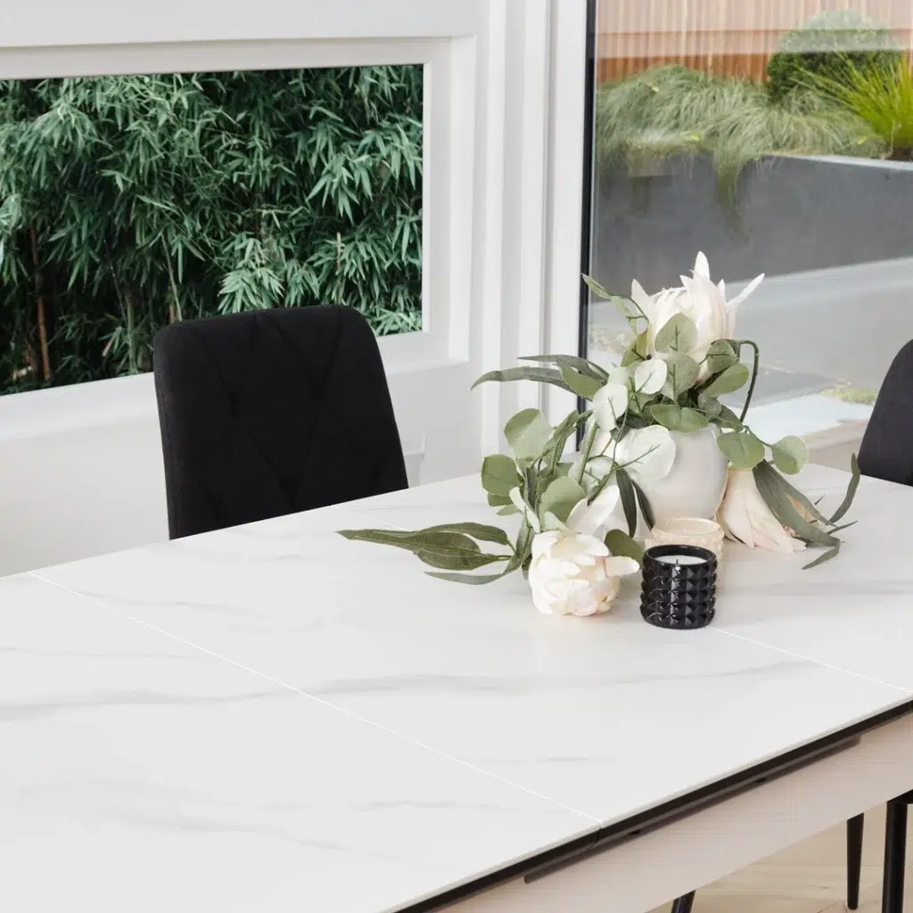 Mila Snow White Ceramic Extendable Dining Table with Marble Effect and Black Rubberwood Frame