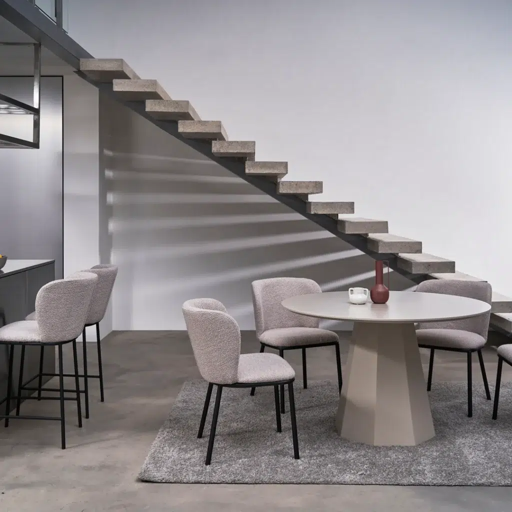Monet dining table in putty finish with wine accent, modern minimalist design for small spaces