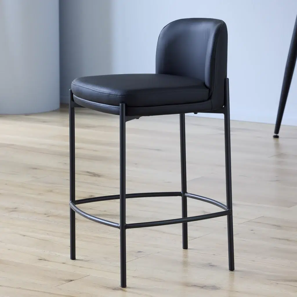 Black Moritz bar stool with eco-leather seat and powder-coated metal frame for modern kitchens and bars