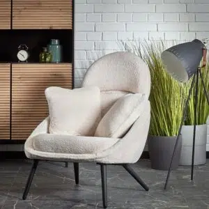 Morgan armchair in white boucle with black legs and foam cushioning for modern spaces