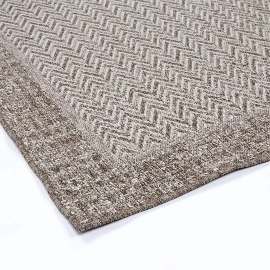 Capri-inspired natural jute rug, handwoven for Bohemian and rustic interiors.