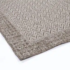 Capri-inspired natural jute rug, handwoven for Bohemian and rustic interiors.