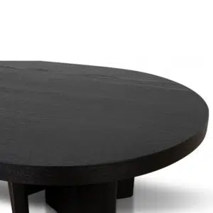 Modern pill-shaped coffee table with textured espresso black finish and open-triangle legs for living room.