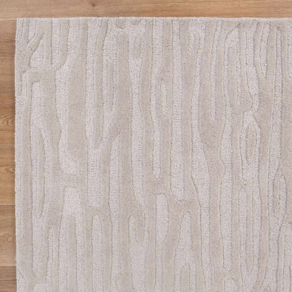 Handmade beige wool rug with natural texture and durability