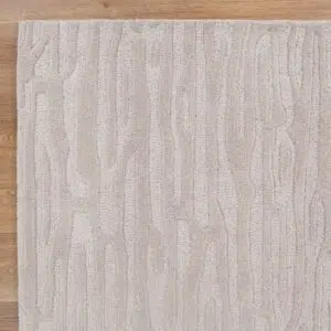 Handmade beige wool rug with natural texture and durability