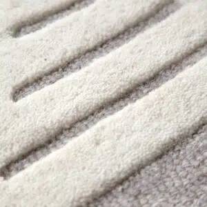 Modern wool rug with natural hues and organic patterns for comfortable decor