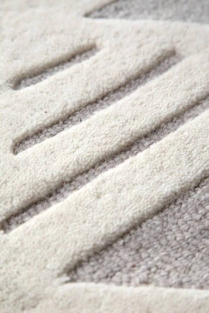Modern wool rug with natural hues and organic patterns for comfortable decor