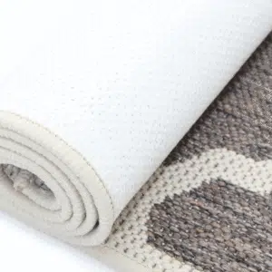 Modern geometric rug with grey and cream color, low maintenance, durable, and neutral tone compatibility.