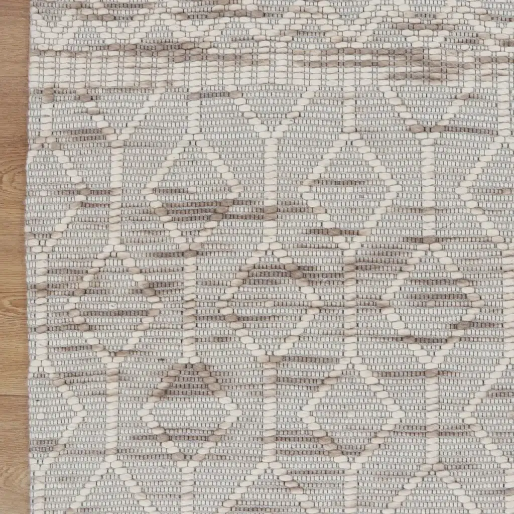 Copacabana lattice beige wool rug hand loomed in India perfect for modern tribal coastal bohemian spaces soft felted wool polyester blend adds sophistication to any room