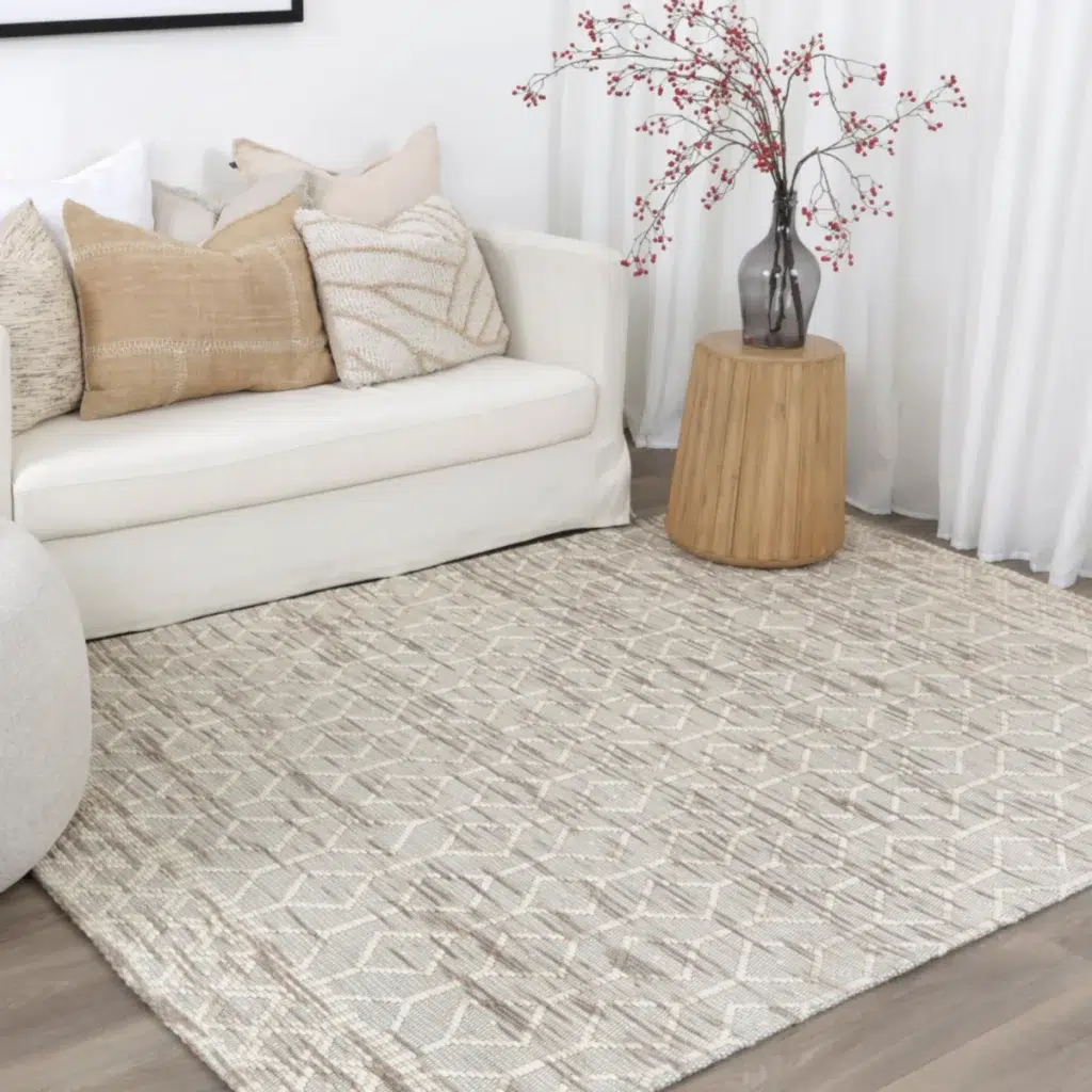 Hand loomed Copacabana beige wool rug with loop pile texture adds sophistication to any space