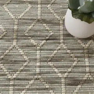Copacabana lattice moss wool rug handloomed flatwoven neutral tones modern coastal bohemian spaces soft durable texture music passion design craftsmanship