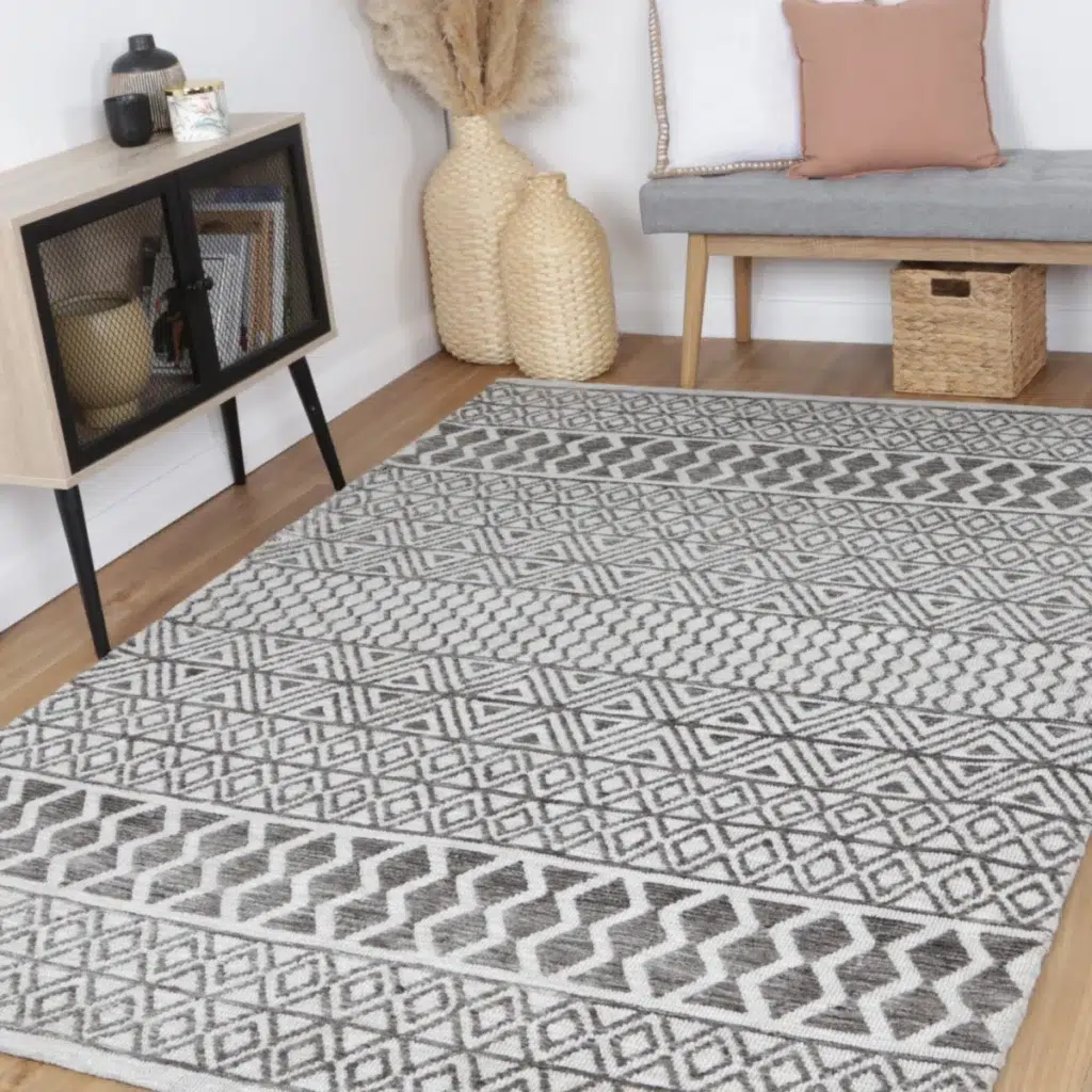Amritsar Ramdass Grey Cotton Blend Rug geometric pattern durable hand tufted polyester cotton backing timeless elegance modern design soft texture luxurious comfort versatile decor styles Indian craftsmanship high traffic areas various sizes available