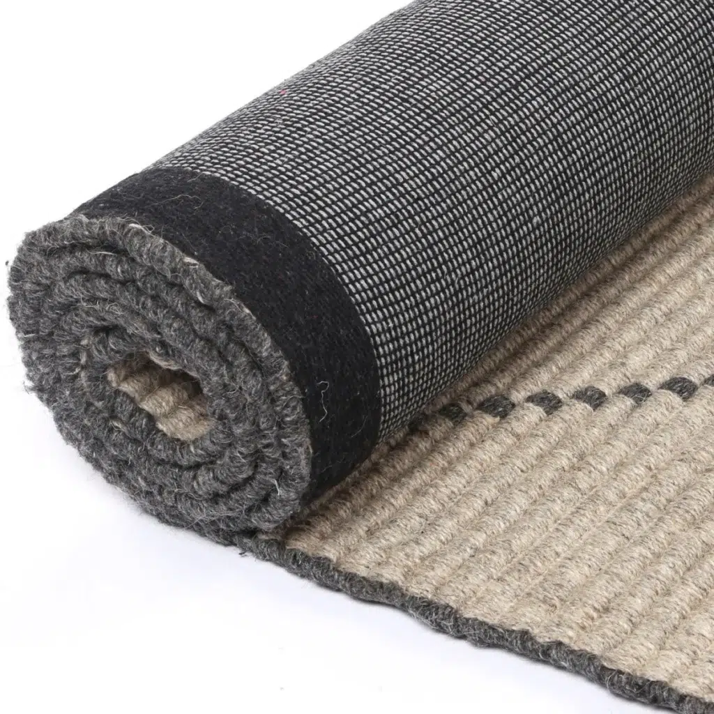 Handcrafted Goa Zig-Zag Wool Blend Ash Rug adds warmth and texture to any room with its durable and luxurious feel