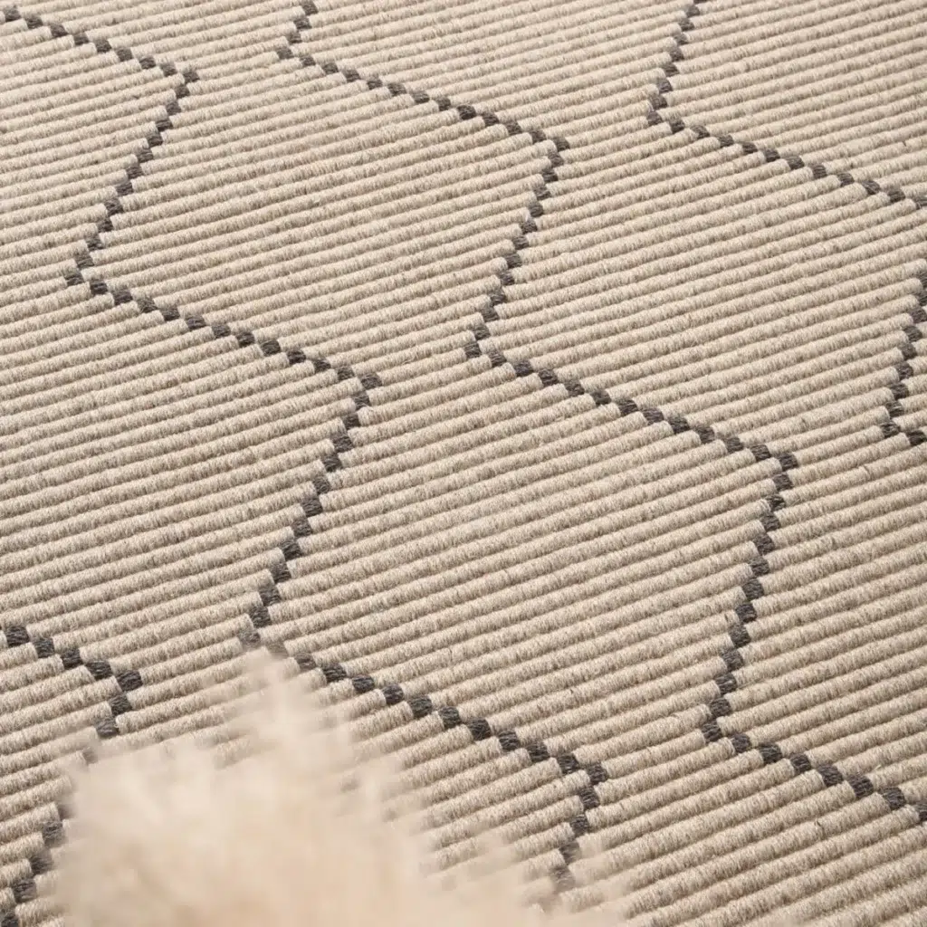 Handcrafted Goa Zig-Zag Wool Blend Ash Rug adds warmth and texture to any room with its durable and luxurious design