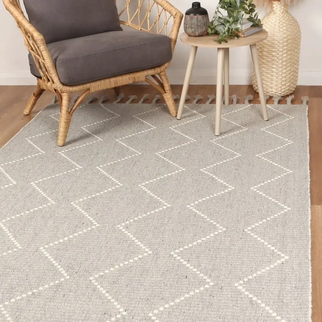Handcrafted Goa Zig-Zag Wool Blend Grey Rug adds warmth and texture to any room with its luxurious feel and modern design