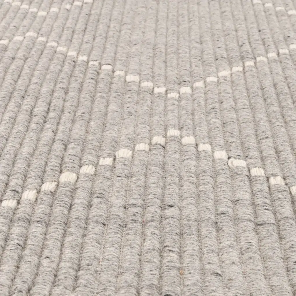 Handcrafted Goa Zig-Zag Wool Blend Grey Rug adds warmth and texture to any room with its luxurious feel and modern design perfect for high traffic areas or bedrooms