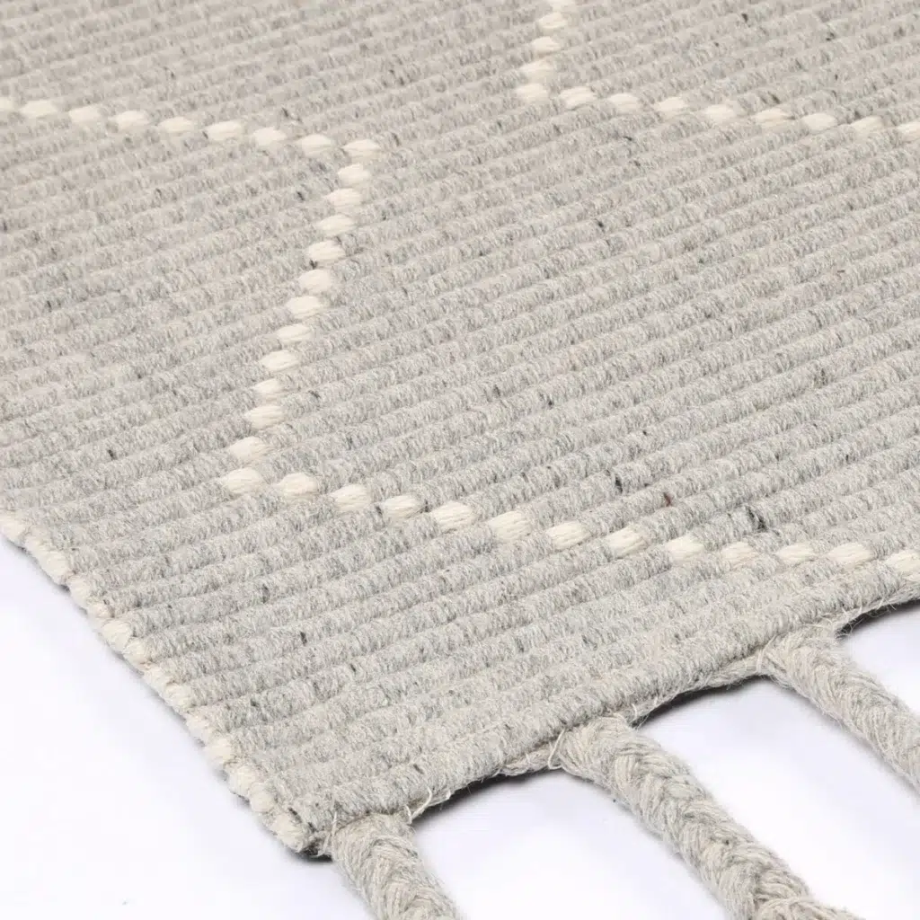 Handcrafted Goa Zig-Zag Wool Blend Grey Rug adds warmth and elegance to any room with its intricate patterns and rich textures ideal for living rooms or bedrooms