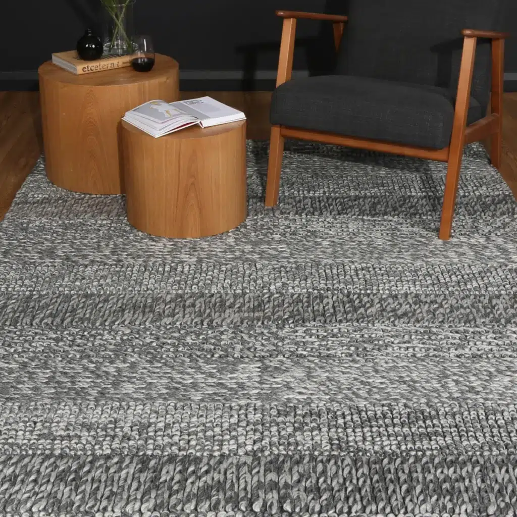 Timeless charcoal wool blend rug adds cozy elegance to any room soft textured pile durable construction neutral tones hand loomed craftsmanship