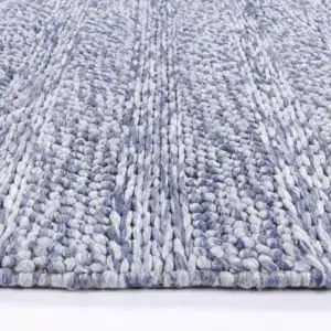 Harlow Ringlets blue wool blend rug adds elegant simplicity and cozy texture to any room