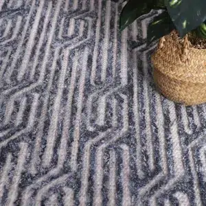 Marbella Almeria Blue Contemporary Rug handmade in India adds cozy texture to any room with rich colors and intricate patterns inspired by diverse design elements perfect for eclectic interiors