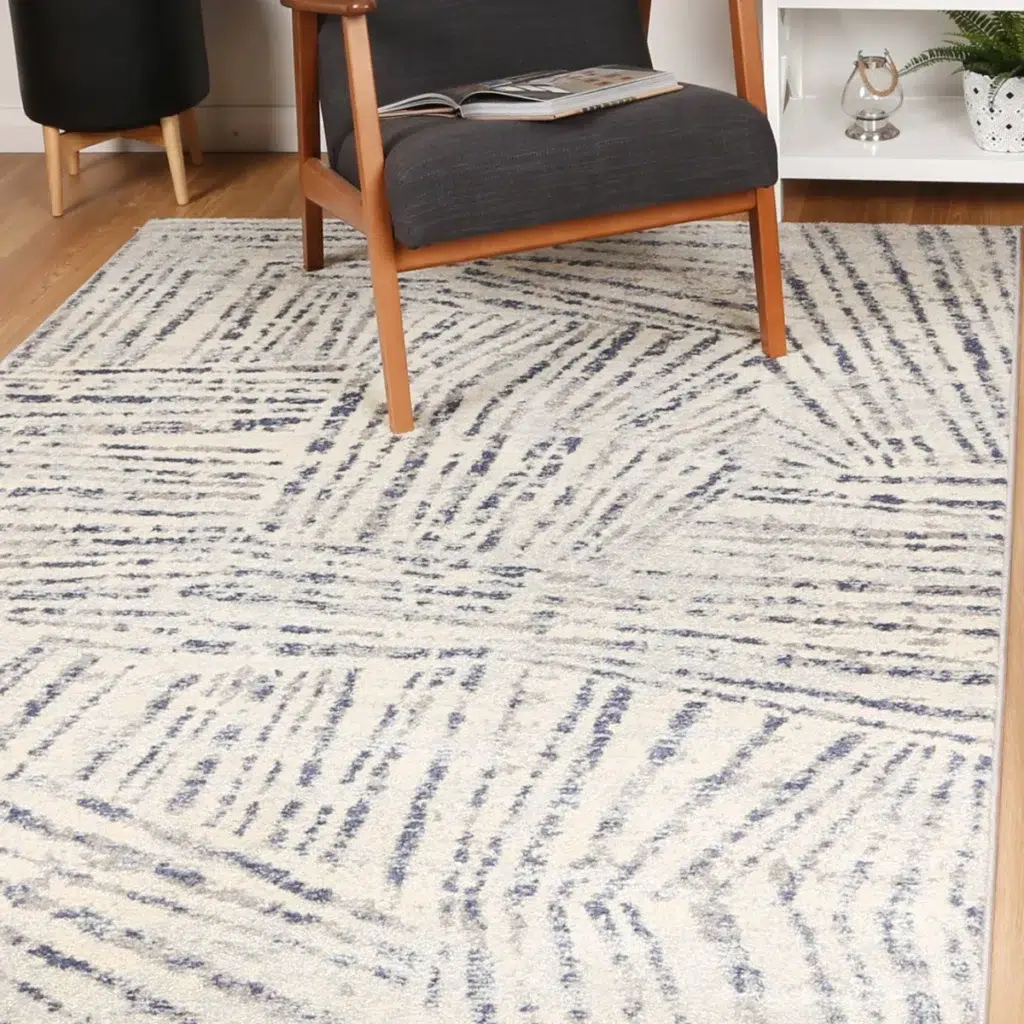 Luxurious Sicily Ferraro Ivory Blue Geometric Rug adds vibrant elegance to any room with easy care synthetic fibers perfect for high traffic areas