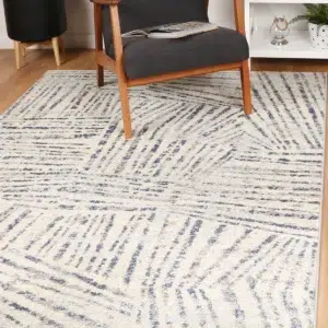 Luxurious Sicily Ferraro Ivory Blue Geometric Rug adds vibrant elegance to any room with easy care synthetic fibers perfect for high traffic areas