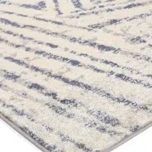Luxurious Sicily Ferraro Ivory Blue Geometric Rug adds vibrant elegance to any room with easy care synthetic fibers