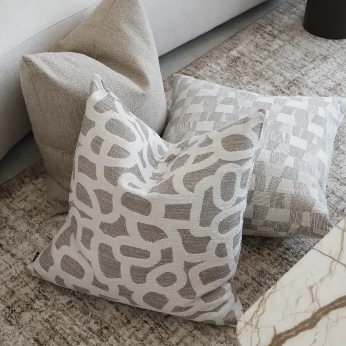 Cove Cushion 55cm in beige with natural speckled woven texture