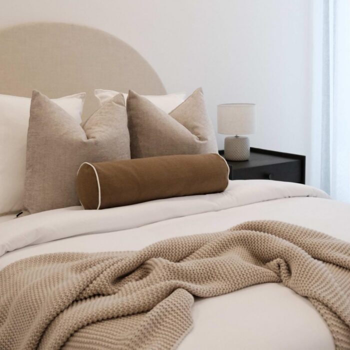 Brown and white striped 55cm bolster cushion for sofa or bed