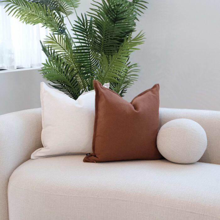 Rust 55cm Edge Cushion in soft woven fabric for cozy home decor