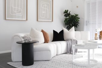 Round coffee table in a cozy living room setup