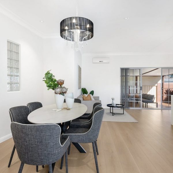 Sage Oval Modern 180cm Dining Table with grey chairs in a contemporary dining room